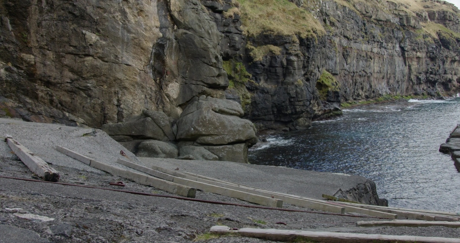 Wide Pan Right of Gjogv Natural Harbor in the Faroe Islands