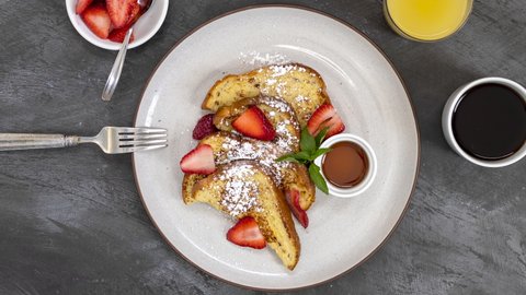 A Rotating Plate of French Toast and Strawberries