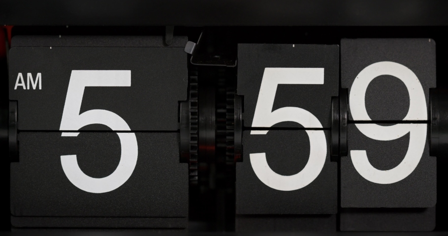 Classic flip clock on black background Showtime am05.59, Time concept.