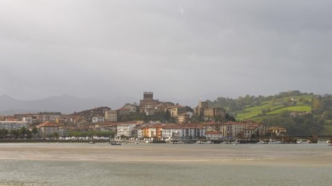 San Vicente de la Barquera view from the other side of Escudo River with mountains in the background, Cantabria, Spain, Europe