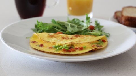 Serving a Cheese Omelet with a Green Salad