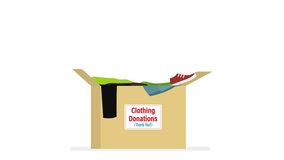 Clothing donation, motion video. Various clothes fall into cardboard box. Charity donation concept, second hand things. Support and humanitarian aid.
