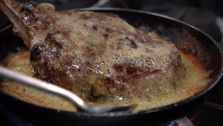 Almost precious beef steak bake in butter. Royalty-Free Stock Footage #1090123641
