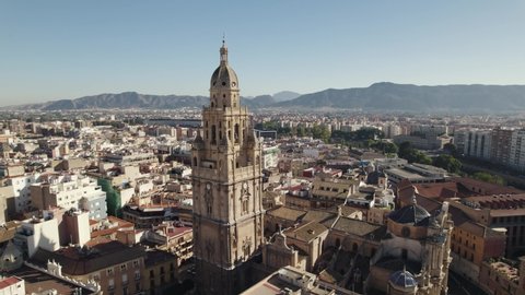 Impressive architecture of Murcia Cathedral bell tower; drone orbit view