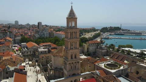 Aerial drone rotating shot of Diocletian's Palace, the bell tower of the cathedral of St Domnius in Split city centre. Diocletian's palace visible in Dalmatia, Croatia.
