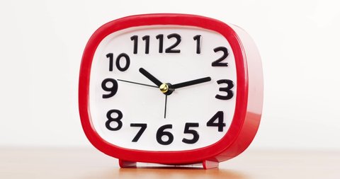 Timelapse 3 hours, Red Alarm clock isolated on white background, Showtime 10.13 am.