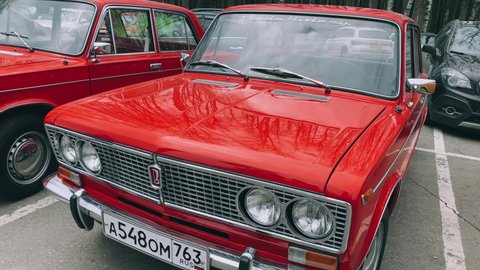 Moscow, 04.2022. The video shows a close-up of Russian Lada red cars in a row. High quality 4k footage