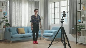 Asian Transgender Male Dancing While Shooting Video Content For Social Networks With A Smartphone Camera
