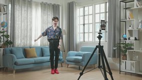 Asian Transgender Male Dancing While Shooting Video Content For Social Networks With A Smartphone Camera
