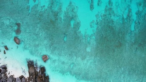 Aerial video of the Andaman Sea, sea waves approaching the paradise beach. Impressive atmosphere The turquoise water looks amazing. on the white sand beach