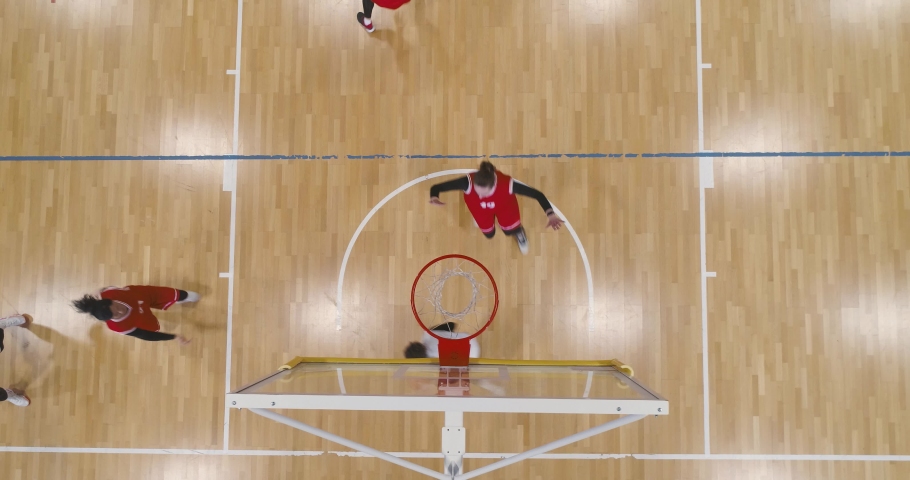Women's basketball championship, training game, the confrontation of two team of basketball players, woman power, view from a height. Royalty-Free Stock Footage #1090147227