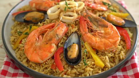 Seafood Paella with prawns, clams, mussels on saffron rice - Spanish food style