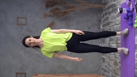 Young latin fitness woman exercising jumping at home. fitness lifting workout with arms up. Healthy lifestyle - Powered by Shutterstock - Get 15% off with code: PIKWIZARD15