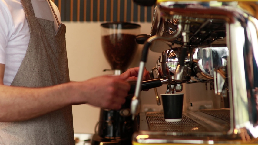 Barista making coffee in a coffee machine Royalty-Free Stock Footage #1090152875