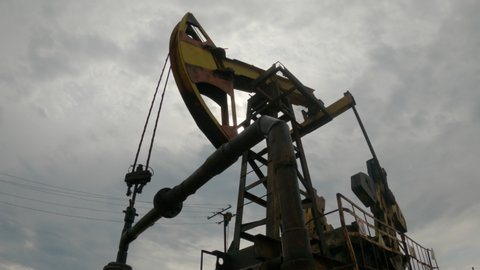 Pump jack for crude oil. Oil rocking chair. Oilfield.