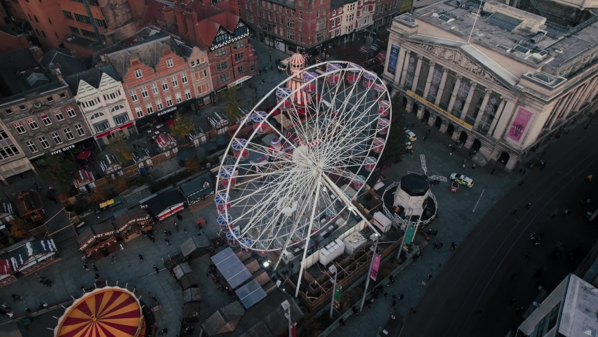 Aerial drone view over Nottingham Town city centre, Old Market Square, Nottingham Winter Wonderland, Nottingham, Nottinghamshire, England, United Kingdom, Europe | Shutterstock HD Video #1090155941