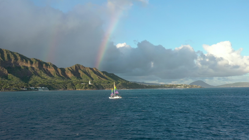 A Sailboat in Hawaii with Diamond Head and Double Rainbow Royalty-Free Stock Footage #1090160299