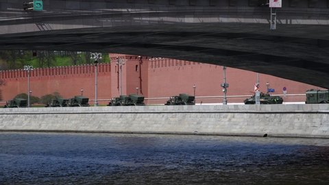 Russia, Moscow - May 7, 2022: Russian multiple rocket launchers Tornado-G and Iskander missiles drives on Kremlevskaya embankment by Moscow Kremlin wall during rehearsal of Russian Victory Day parade.