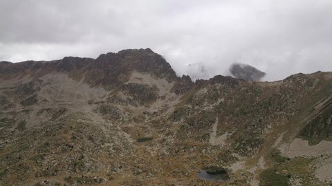 Aerial shot of the Landscape of Andorra  Mountains, Lakes and Valleys in the Pyrenees in the Summer  Cloudy Weather