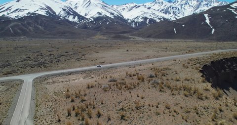 Aerial view of a car passing the edge of the Pozo de las animas (Well of the Soul)  Located in Mendoza, Argentina 