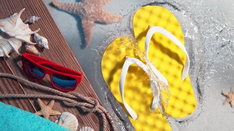 Super Slow Motion Shot of Yellow Flip Flops Splashing Into Clear Sea Water at 1000 fps, Vacation Concept.