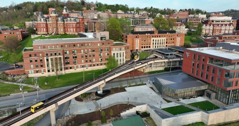 Morgantown , WV , United States - 04 29 2022: Iconic aerial of West Virginia University. Personal Rapid Transit system. Woodburn Hall and academic buildings on downtown Morgantown WV campus.