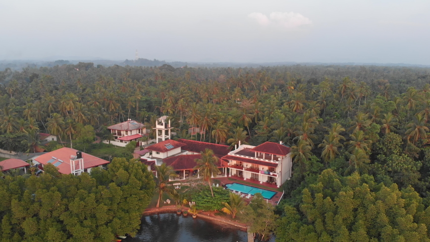 Hotel on the Bentota Ganga in Sri Lanka with the jungle behing.