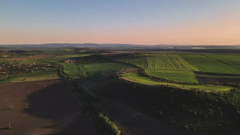 Beautiful landscape view on the stunning nature with green fields with perfect soft sun set light and blue sky over the horizon in the Varna region nice valley.