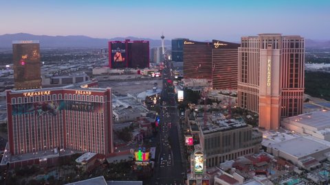 Aerial view of Las Vegas, the largest city in Nevada and entertainment capital North America, showing casino and resorts landmark buildings in STRIP district at scenic sunset. Las Vegas USA Apr 2022