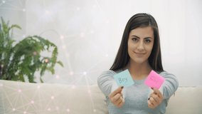 4k slow motion video of pregnant woman holding pink and blue papers which mean gender of future baby.