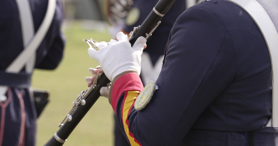 Military band playing music in the celebration of an event. Marching band Orchestra playing music with instruments. Independence day or war veterans day.
Musicians playing the funeral march.