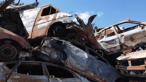 Shot and burned cars after the fighting in the city of Irpin, Ukraine - Powered by Shutterstock - Get 15% off with code: PIKWIZARD15