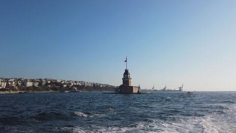 Kiz Kulesi or Maiden's Tower with Salacak coast of Uskudar District in Istanbul from a ferry. Travel to Istanbul background video.