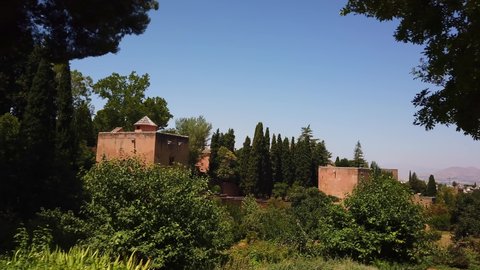 Alhambra, Granada, Spain - July 18 2019 : Fortresses, gardens and surrounding houses of the Alhambra complex.