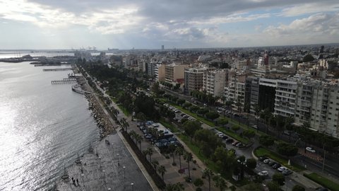Molos Cyprus promenade in Limassol. Drone fly over one of the most famous promenades in Cyprus in the early morning. City view.