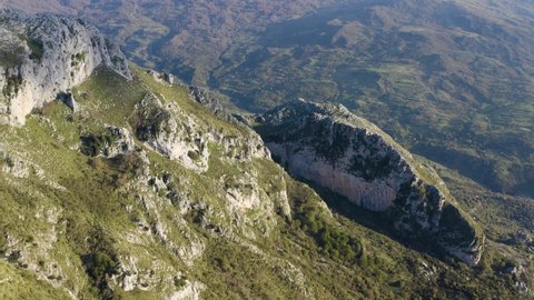 Aerial shot with drone of the Rocche del Crasto, a mountainous and rocky complex where the golden eagle nests, Nebrodi, Sicily, Italy. Grotta del Lauro and Stretta del Paratore or Longi.