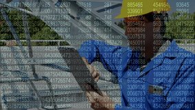 Screen with data processing against caucasian male engineer using digital tablet. engineering and renewable energy concept - Powered by Shutterstock - Get 15% off with code: PIKWIZARD15