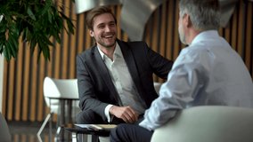 Professional investment consultant consult client investor about financial contract explain online startup purchase deal sell service make business offer give presentation advice at meeting - Powered by Shutterstock - Get 15% off with code: PIKWIZARD15