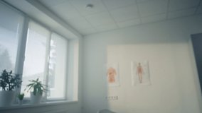 Pov video handsome european doctor consulting patient in health clinic closeup. Smiling man physician giving medical advice in hospital office. Young medicine professional working in modern workplace.