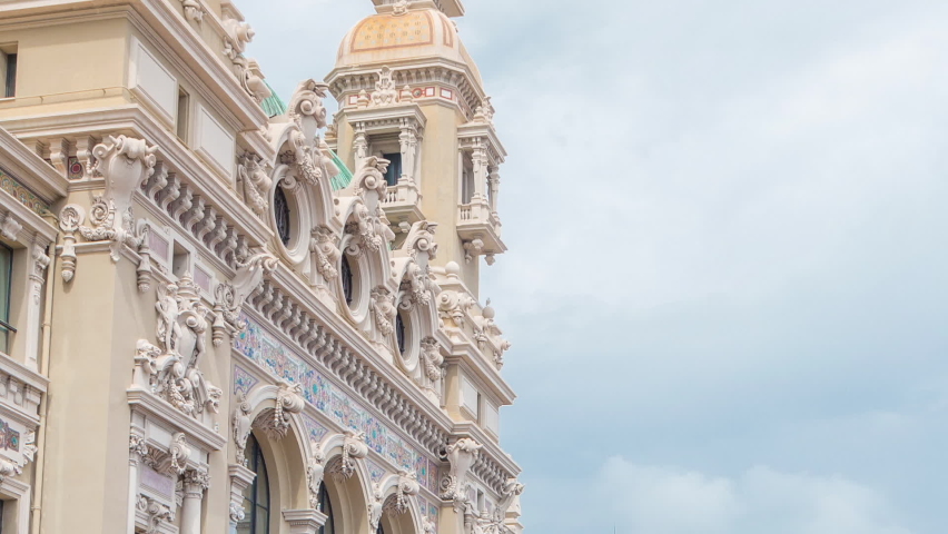 Back side of 19th century baroque style palace of the Monte Carlo Casino timelapse in Monaco. Cloudy sky at summer day