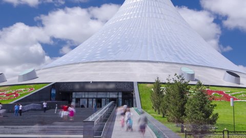Entrance to Khan Shatyr timelapse hyperlapse in Nur-Sultan city. Khan Shatyr located in Astana, the capital of the Republic of Kazakhstan. Residents of the city are walking and resting.