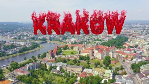 Inscription on video. Krakow, Poland. Wawel Castle. Ships on the Vistula River. View of the historic center. Flames with dark fire, Aerial View, Point of interest