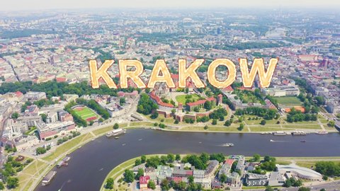 Inscription on video. Krakow, Poland. Wawel Castle. Ships on the Vistula River. View of the historic center. Heat burns text, Aerial View, Departure of the camera