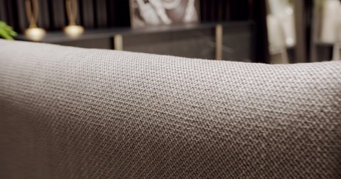 Close Up Textil Comfortable Sofa. Minimalist gray fabric beige sofa . Modern and Cosy House. Luxury Apartment. Modern Furniture in cozy Penthouse. Modern and Simple Sofa. Modern Living Room Interior