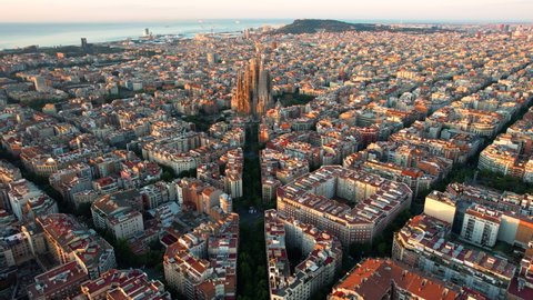 Barcelona skyline with Sagrada Familia Cathedral at sunrise. Catalonia, Spain. Aerial view
