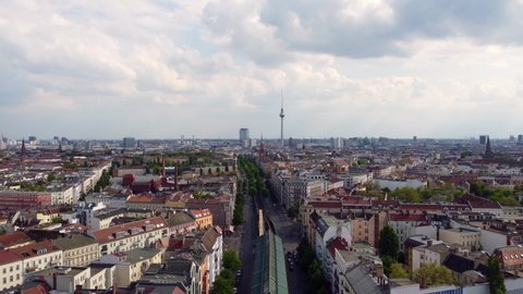 Overview panorama TV Tower, Mauerpark and Jahn Sportpark. Beautiful aerial view flight panorama curve drone footage of Berlin Prenzlauer Berg Schönauer Allee Spring 2022 Cinematic by Philipp Marnitz