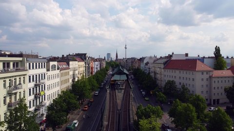A yellow subway train waiting to be allowed to leave the platform.
Fantastic aerial view flight hover drone footage
of Berlin Prenzlauer Berg Schönauer Allee Spring 2022. Cinematic by Philipp Marnitz