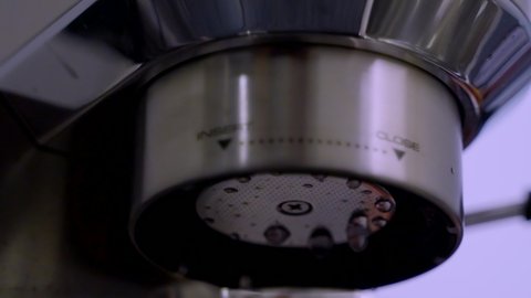 footage of an esspresso machine performing automatic descaling