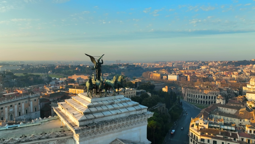 The Altare della Patria in Rome.
Backlight aerial view on the Roman Forum and Colosseum with the sunrise sun. Royalty-Free Stock Footage #1090201669