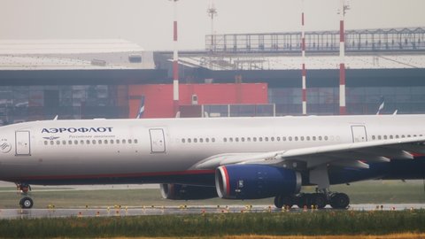 MOSCOW, RUSSIAN FEDERATION - JULY 30, 2021: Side view Airbus A330 of Aeroflot taxiing on the runway at Sheremetyevo Airport (SVO). Travel and tourism concept.